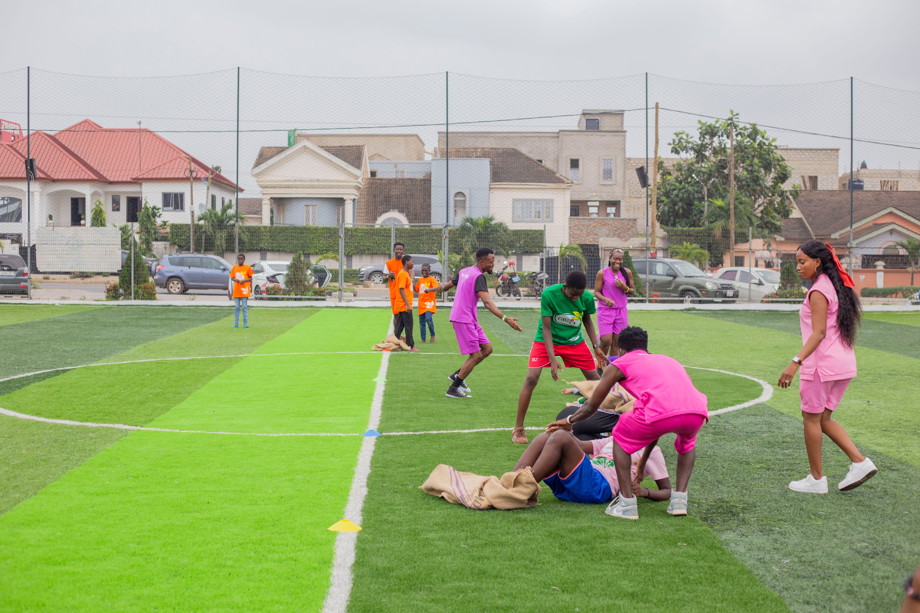 A sack race at a Field of Grace community day